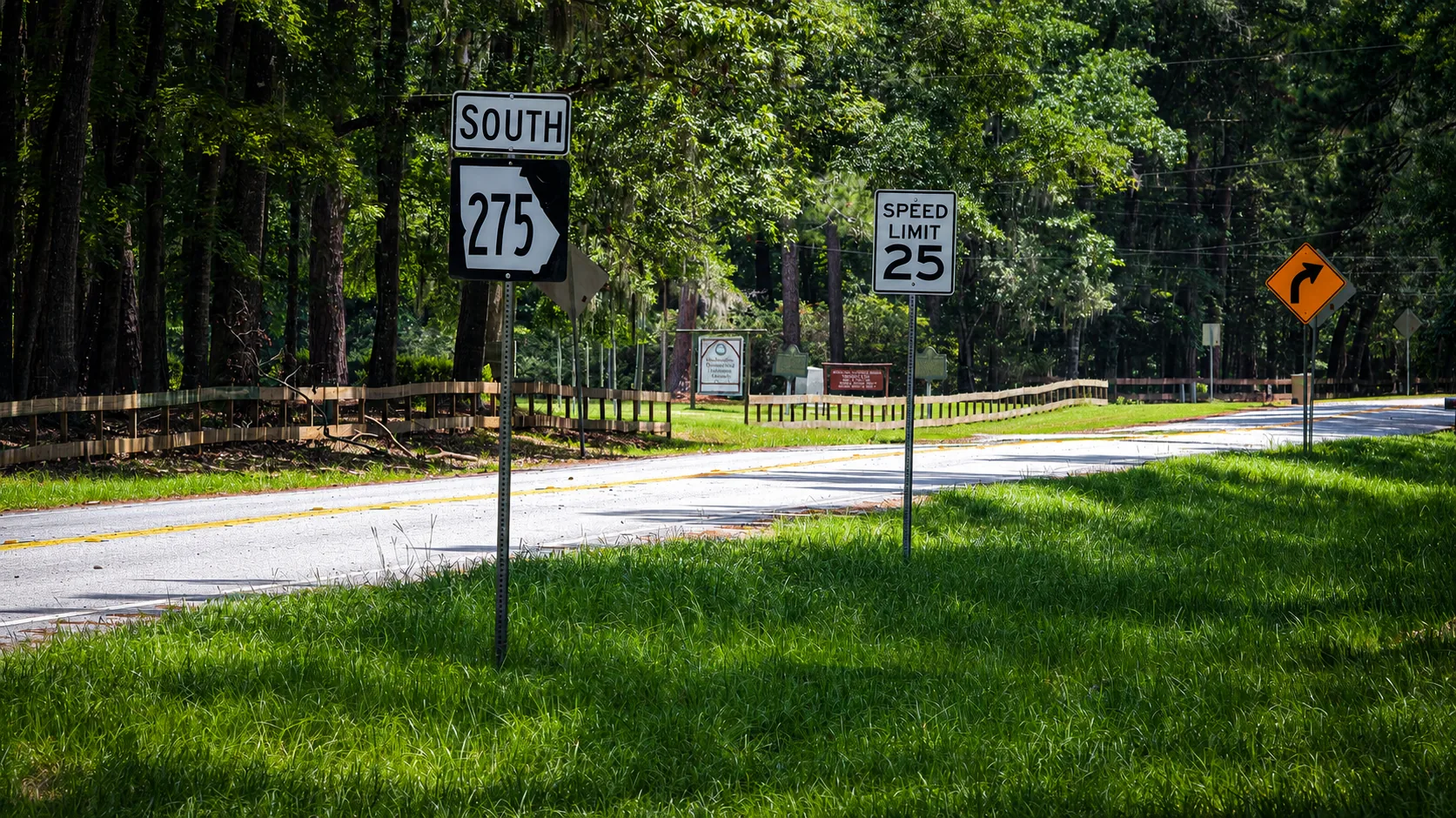 State Route 275 winding through a wooded area in Springfield, Georgia.